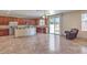 Open kitchen with stainless appliances and backyard access at 4016 Gaster Ave, North Las Vegas, NV 89081