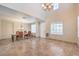 Spacious living room showcasing tile floors, high ceilings, and modern lighting fixtures at 4016 Gaster Ave, North Las Vegas, NV 89081