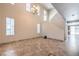 Inviting living room boasting high ceilings, tile floors, and a staircase at 4016 Gaster Ave, North Las Vegas, NV 89081
