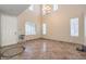 Bright living room featuring tile floors, high ceilings, and ample natural light at 4016 Gaster Ave, North Las Vegas, NV 89081