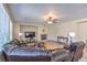 Spacious living room with a fireplace, large windows, and comfortable seating arrangement at 4016 Gaster Ave, North Las Vegas, NV 89081