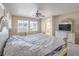 Bright main bedroom with large windows and neutral decor at 4016 Gaster Ave, North Las Vegas, NV 89081