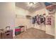 A standard walk-in closet features carpet flooring and wire shelving for ample storage space at 4016 Gaster Ave, North Las Vegas, NV 89081