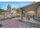 Spacious backyard patio with partial cover, ideal for outdoor entertaining and relaxation at 4215 Macadamia Dr, Las Vegas, NV 89115