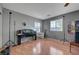 Spacious bedroom with natural light, wood floors, ceiling fan, and ample space for personalization at 4215 Macadamia Dr, Las Vegas, NV 89115