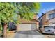 Charming two-story home with a two-car garage and well-maintained landscaping at 4215 Macadamia Dr, Las Vegas, NV 89115