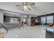 Spacious living room features tile flooring and ceiling fans, perfect for entertaining at 4215 Macadamia Dr, Las Vegas, NV 89115