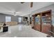 Spacious living room features tile flooring, ceiling fans, and built in cabinets at 4215 Macadamia Dr, Las Vegas, NV 89115