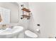 Modern powder room featuring floating shelves and sleek fixtures at 4332 Stardusk Falls Ave, North Las Vegas, NV 89084