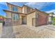 Close up of the front exterior showing a stone accent wall and brick-paved walkway at 4332 Stardusk Falls Ave, North Las Vegas, NV 89084