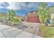 View of the home showcasing the driveway and desert landscaping, as well as the beautiful curb appeal at 4332 Stardusk Falls Ave, North Las Vegas, NV 89084