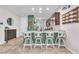 The modern kitchen features barstool seating and stylish decor with pendant lighting at 4332 Stardusk Falls Ave, North Las Vegas, NV 89084