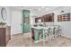 Charming kitchen featuring green accent walls, ample counter space, and barstool seating at 4332 Stardusk Falls Ave, North Las Vegas, NV 89084