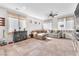 Spacious living room with neutral walls, tile flooring, and lots of natural light at 4332 Stardusk Falls Ave, North Las Vegas, NV 89084