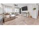 Bright living room boasts a comfortable couch, tile floors, and media center at 4332 Stardusk Falls Ave, North Las Vegas, NV 89084