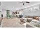 Open-concept living area with barstool seating overlooking the kitchen, perfect for entertaining at 4332 Stardusk Falls Ave, North Las Vegas, NV 89084