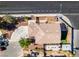 An aerial view of a house with a circular driveway and a well-maintained backyard at 4512 Long Horse Ct, Las Vegas, NV 89147