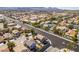 Elevated view of a suburban neighborhood displaying varied architectural styles, roads, and green spaces at 4512 Long Horse Ct, Las Vegas, NV 89147