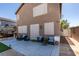 Inviting backyard featuring a seating area, outdoor lighting, and access to yard space at 4512 Long Horse Ct, Las Vegas, NV 89147
