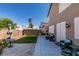 Relaxing backyard view with dining area, patio, artificial grass and privacy fencing at 4512 Long Horse Ct, Las Vegas, NV 89147
