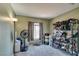 Cozy bedroom with carpet, floor lamp, and rack filled with shoes at 4512 Long Horse Ct, Las Vegas, NV 89147