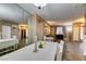 Bright dining room with white table set, neutral walls, and tile floors at 4512 Long Horse Ct, Las Vegas, NV 89147