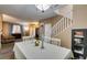 Dining room with view to entry; features a staircase with white railing at 4512 Long Horse Ct, Las Vegas, NV 89147
