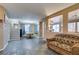 Open-concept dining room with neutral paint, tiled floors, and staircase at 4512 Long Horse Ct, Las Vegas, NV 89147