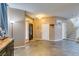 Foyer features tiled floors, neutral paint, a front door with sidelights, and a staircase at 4512 Long Horse Ct, Las Vegas, NV 89147