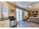Open-concept kitchen featuring stainless steel appliances, and sliding door to outdoor area at 4512 Long Horse Ct, Las Vegas, NV 89147