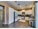 Well-lit kitchen boasts white cabinetry, stainless steel appliances, and ample counter space at 4512 Long Horse Ct, Las Vegas, NV 89147