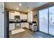 Spacious kitchen with ample countertop space, stainless steel appliances, and convenient outdoor access at 4512 Long Horse Ct, Las Vegas, NV 89147