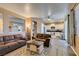 Living room with tile flooring, sofa and open view to kitchen at 4512 Long Horse Ct, Las Vegas, NV 89147