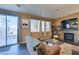 Living room with fireplace, backyard access and plenty of natural light at 4512 Long Horse Ct, Las Vegas, NV 89147