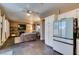 Open floor plan with seamless flow from kitchen to living room, featuring tile flooring at 4512 Long Horse Ct, Las Vegas, NV 89147
