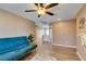 Bright living space with wood floors, ceiling fan, and natural light, offering a versatile area at 4512 Long Horse Ct, Las Vegas, NV 89147