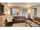 Open living room with view into entry, tile floors and comfortable seating at 4512 Long Horse Ct, Las Vegas, NV 89147