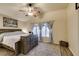 Spacious main bedroom features a ceiling fan, natural light, and an eye-catching decorative rug at 4512 Long Horse Ct, Las Vegas, NV 89147