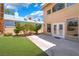 View of backyard with patio, lush lawn, and attractive exterior featuring mature landscaping at 5225 Sandy Cactus Ln, Las Vegas, NV 89149