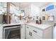 Wet bar featuring white cabinetry, quartz countertop, and beverage cooler at 5225 Sandy Cactus Ln, Las Vegas, NV 89149