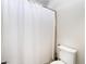 Bathroom with toilet and white shower curtain at 5225 Sandy Cactus Ln, Las Vegas, NV 89149