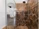 Elegant bathroom with a walk-in shower featuring intricate tile work and modern fixtures at 5225 Sandy Cactus Ln, Las Vegas, NV 89149