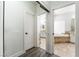 Open view of bathroom with a jacuzzi tub, neutral tile surround, a glass shower, and modern fixtures at 5225 Sandy Cactus Ln, Las Vegas, NV 89149