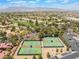 Aerial view of community tennis and pickleball courts and surrounding landscape at 5225 Sandy Cactus Ln, Las Vegas, NV 89149
