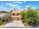 Charming two-story home with a red tile roof and mature landscaping at 5225 Sandy Cactus Ln, Las Vegas, NV 89149
