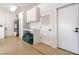 Well-organized garage with built-in cabinets, a utility sink, and access doors for convenience at 5225 Sandy Cactus Ln, Las Vegas, NV 89149
