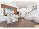 Spacious living room with high ceilings, bar, and staircase with black handrail at 5225 Sandy Cactus Ln, Las Vegas, NV 89149