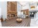 Living room showcases a stone fireplace and bar, blending comfort and entertainment at 5225 Sandy Cactus Ln, Las Vegas, NV 89149