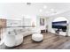 Cozy upstairs loft area with plush seating, modern decor, and hardwood floors at 5225 Sandy Cactus Ln, Las Vegas, NV 89149