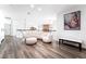 Comfortable upstairs loft area with white couch, hardwood floors, and natural light at 5225 Sandy Cactus Ln, Las Vegas, NV 89149